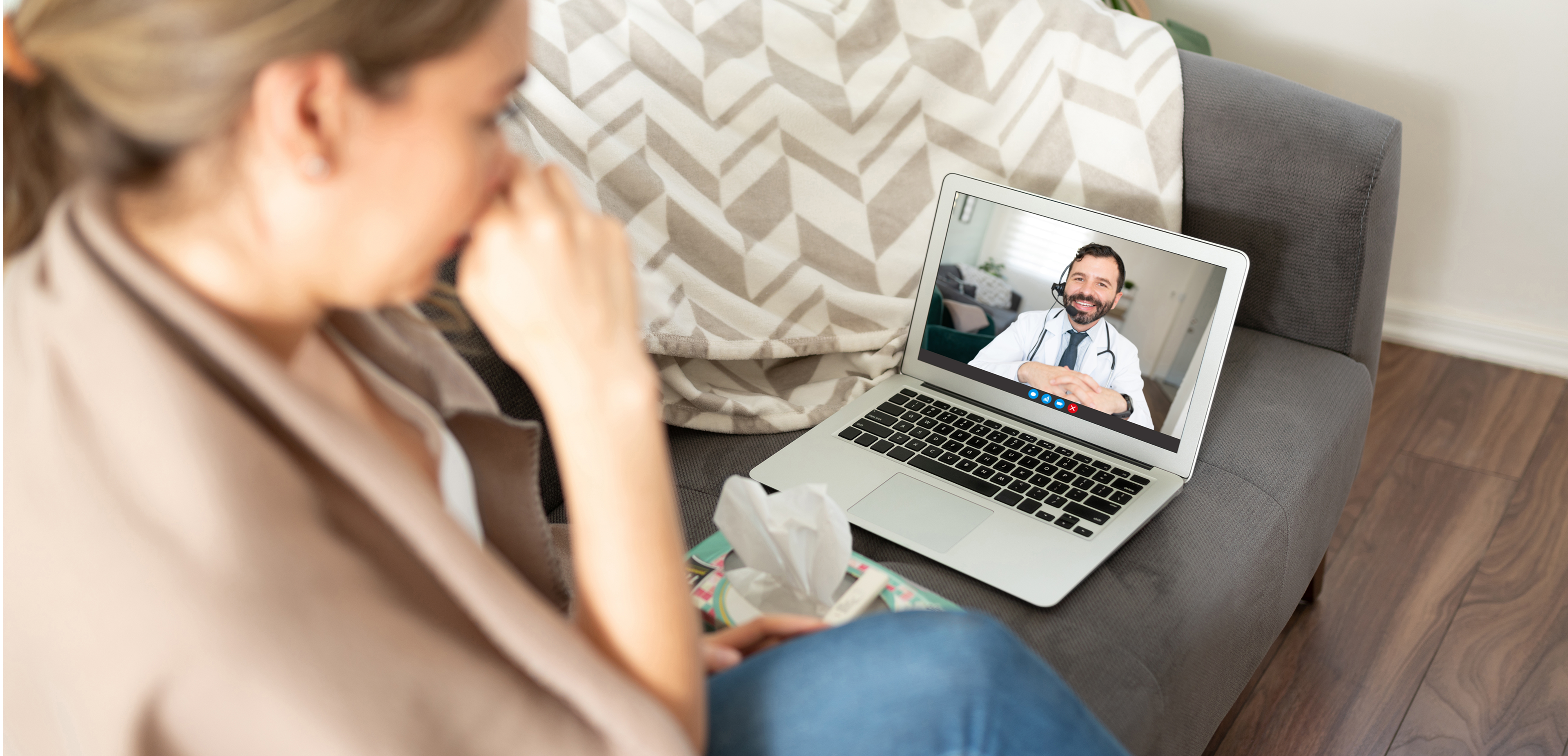 Patient speaking with a GP via video call during an online doctor consultation